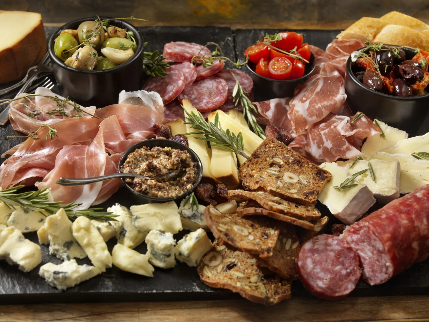 An overflowing charcuterie board